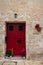 Bright colourful door way in a stone building