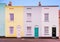 Bright colourful symmetrical row, terrace houses each with two s