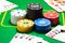 Bright columns of poker chips and various combinations of playing cards