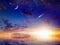 Bright comet, stars and crescent in sunset sky with reflection i