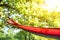 Bright comfortable hammock hanging in garden