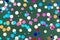 Bright confetti background on green desk