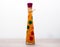 Bright decorative sealed glass bottle with carrot