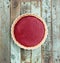 Bright delicious lingonberry open pie on shabby wooden blue back