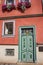 Bright doors and windows with flowers. Facade of the old house. Erfurt, Germany