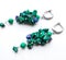 Bright earrings made of natural stones on a white background. Natural malachite and lapis lazuli.