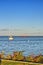 Bright evening sun beats down the lake and the vessels - Thunder Bay Marina, Ontario, Canada