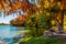 Bright fall foliage and picnic table on Texas river.