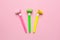 Bright festive background of pink color for a birthday or other holiday, with pipes pink, yellow and green colour
