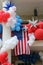 Bright, festive display of red, white and blue balloons on Independence Day.