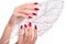 Bright festive red manicure on female hands. Nails design