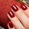 Bright festive red manicure on female hands. Nails design