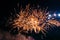 Bright, fiery fireworks against the background of the night sky.