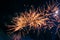 Bright, fiery fireworks against the background of the night sky.