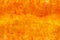 Bright fiery seamless texture in orange and yellow tones with veins and scratches