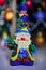 Bright figure of Santa Claus with a bell
