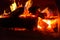 Bright fire red hot glowing logs fever for cooking dishes, background colorful base design hearth