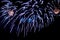 Bright fireworks scattering of sparks of blue color.