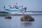 Bright fishing boat in the roadstead in the morning at low tide