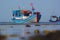 Bright fishing boat in the roadstead in the morning at low tide