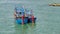 Bright fishing boats in the bay, Vietnam. blue boats with red details