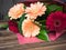 Bright flowers on wooden background. Bridal bouquet, wedding flowers closeup. Decoration made of chrysanthemums, daisies