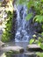 Bright flowing waterfall landscape at Queen Elizabeth Park Garden, 2018