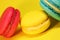 Bright food photography of macroons on yellow