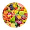 Bright fruits and vegetables in round frame on white