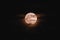 Bright full moon captured in the dark sky at night