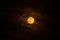 A bright full moon in full glory in the night sky. The Blood Moon on Halloween night. Natural background