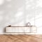 Bright gallery room interior with empty white wall with sideboard