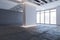 Bright gallery warehouse interior with mock up place on concrete walls and panoramic windows with city view.