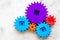 Bright gears for great technology of team work and correct mechanism on stone background top view copyspace
