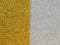 Bright glittery golden yellow and half silver gray background