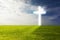 A bright glowing cross on a green field