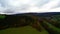 Bright green fields, forests in autumn colors season. Drone Aerial View