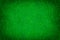 bright green matte background of suede fabric, closeup. texture of seamless emerald woolen felt