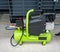 Bright green portable air compressor and accessories