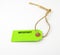 Bright green reminder tag with twine