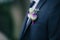 Bright groom boutonniere