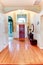 Bright hallway with arch and high ceiling