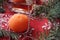 bright holiday background, red texture table with Christmas tree decorations and candles, holiday, a cozy home, time of miracles