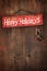 Bright holiday sign on wooden wall