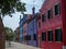 Bright homes on street in Burano Venice Italy