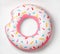 Bright inflatable donut on white background