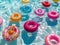 Bright inflatable toys bobbing on crystalclear pool waters surrounded by a lively party atmosphere sunbathing and games