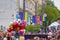 Bright joyful balloons in the air, European flags and people crowd in Soborna Street, Vinnytsia city downtown