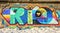 Bright and juicy graffiti of word RIO on the wall at sunny day in Ipanema beach