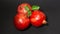 Bright juicy pomegranate fruits, black background, close up